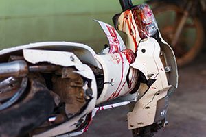 Blood on a white motorcycle after an accident